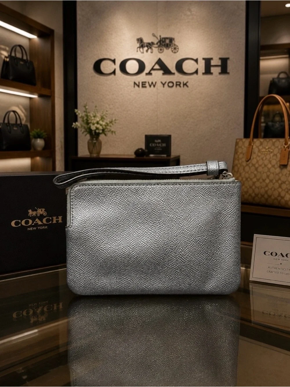 Coach Metallic Light Blue Leather Wristlet with Gold Logo
